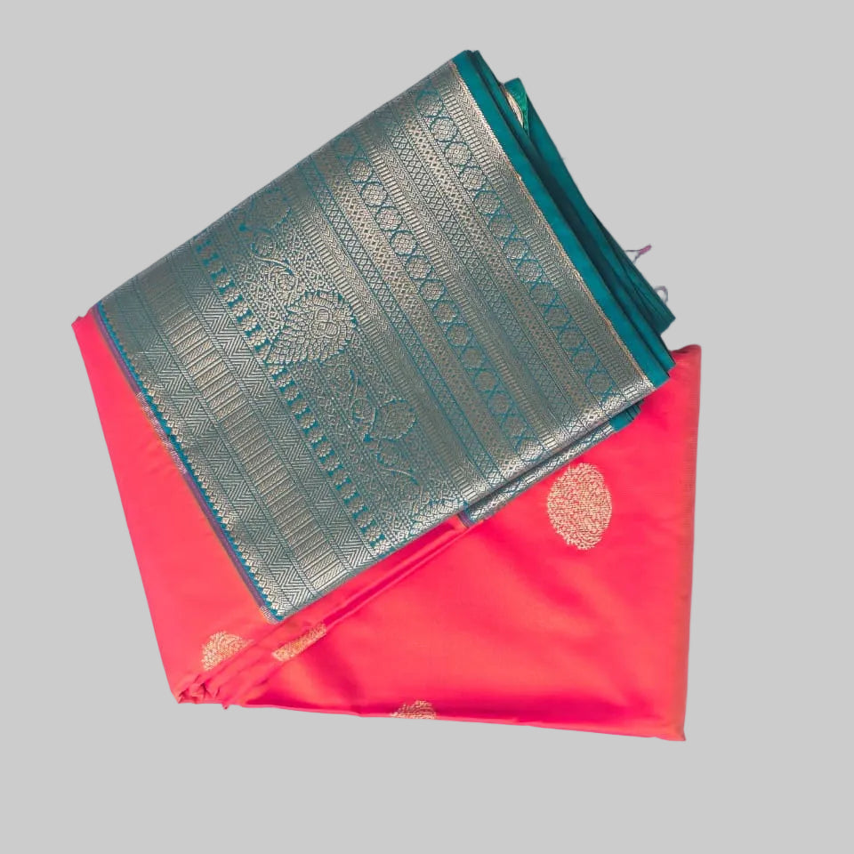 Bright peach orange butta semi kanchipuram silk with heavy green border