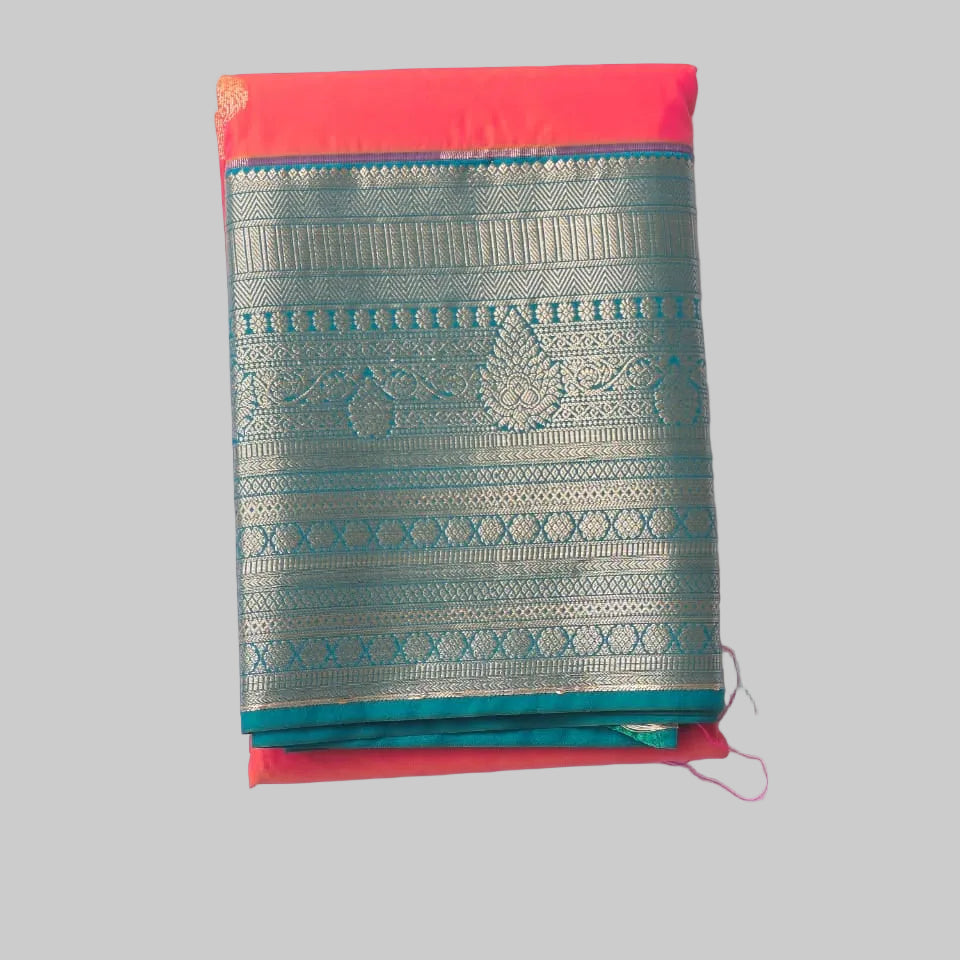 Bright peach orange butta semi kanchipuram silk with heavy green border