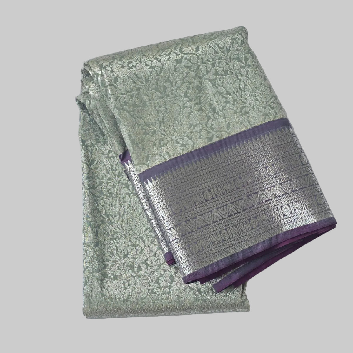 Rich white semi kanchipuram silk saree with lavender heavy border