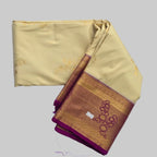 Cream coloured body with golden flower print semi kanchipuram silk saree with Purple border