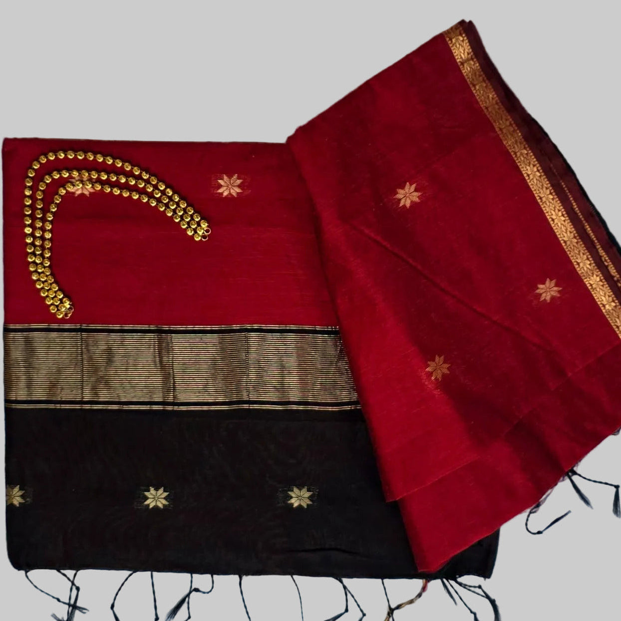 Red colour cotton silk saree with black and golden border