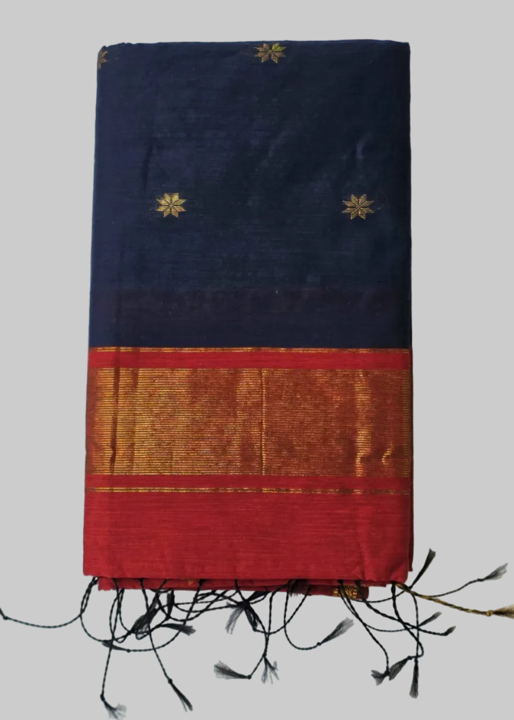 Navy blue cotton silk saree with bright red colour and golden border