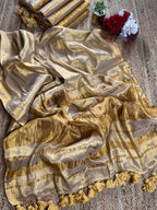 Kanchi tissue saree in a beautiful golden yellow colour with an elegant and graceful look.