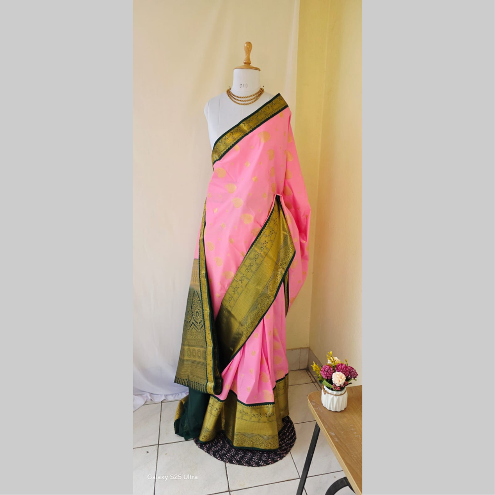 Light pink color with butta semi kanchipuram silk saree with dark green border