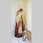 Cream coloured body with golden flower print semi kanchipuram silk saree with Purple border