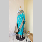 Sea blue butta semi kanchipuram silk with heavy dark green border