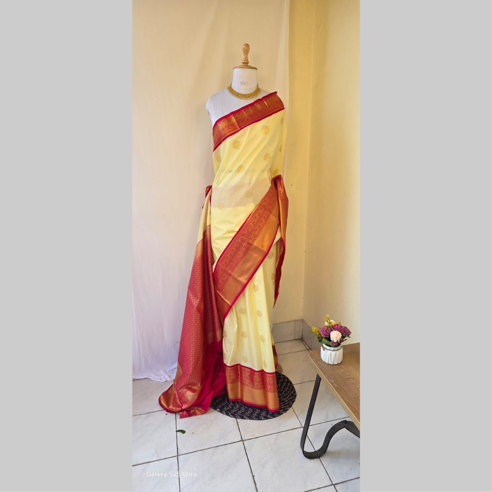 Off white with rich rani pink boarder semi kanchipuram saree