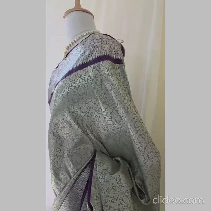 Rich white semi kanchipuram silk saree with lavender heavy border