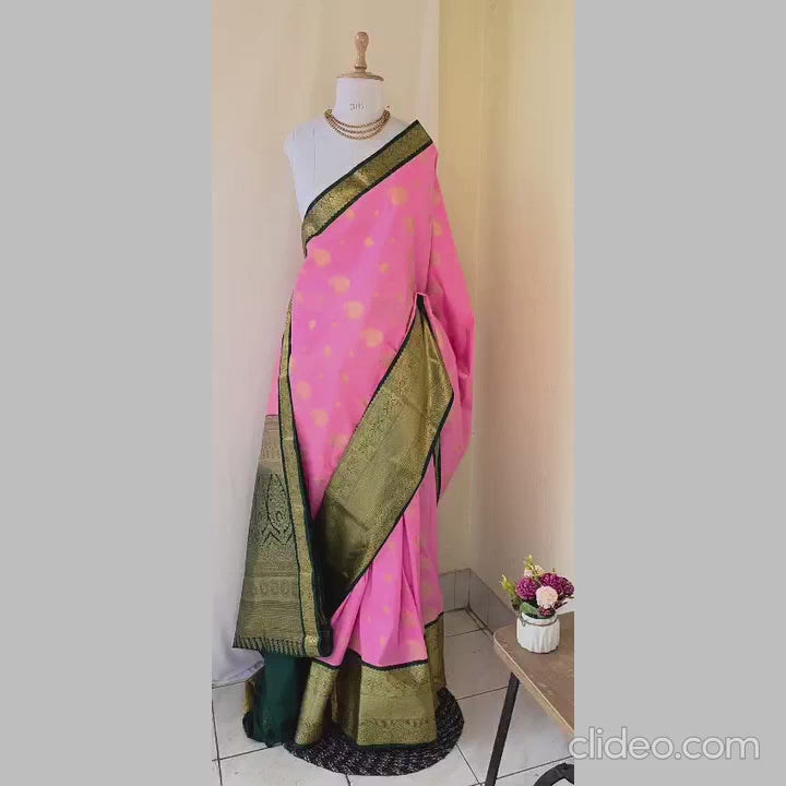 Light pink color with butta semi kanchipuram silk saree with dark green border