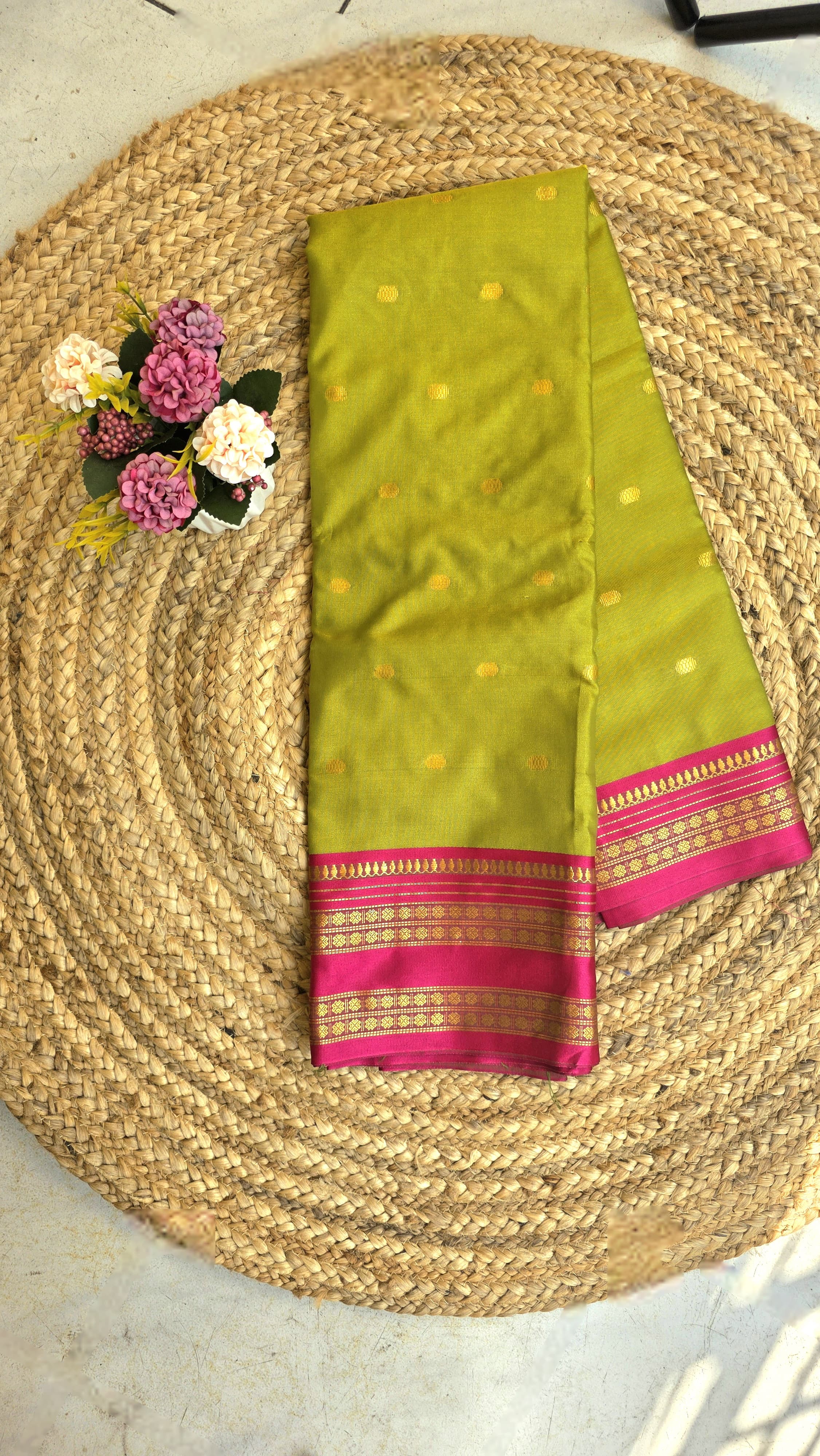 Parrot green colour semi silk saree with rani pink border