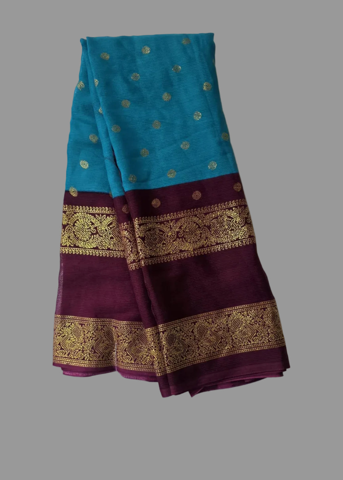 Blue colour foil printed saree with coffee colour border with buttas