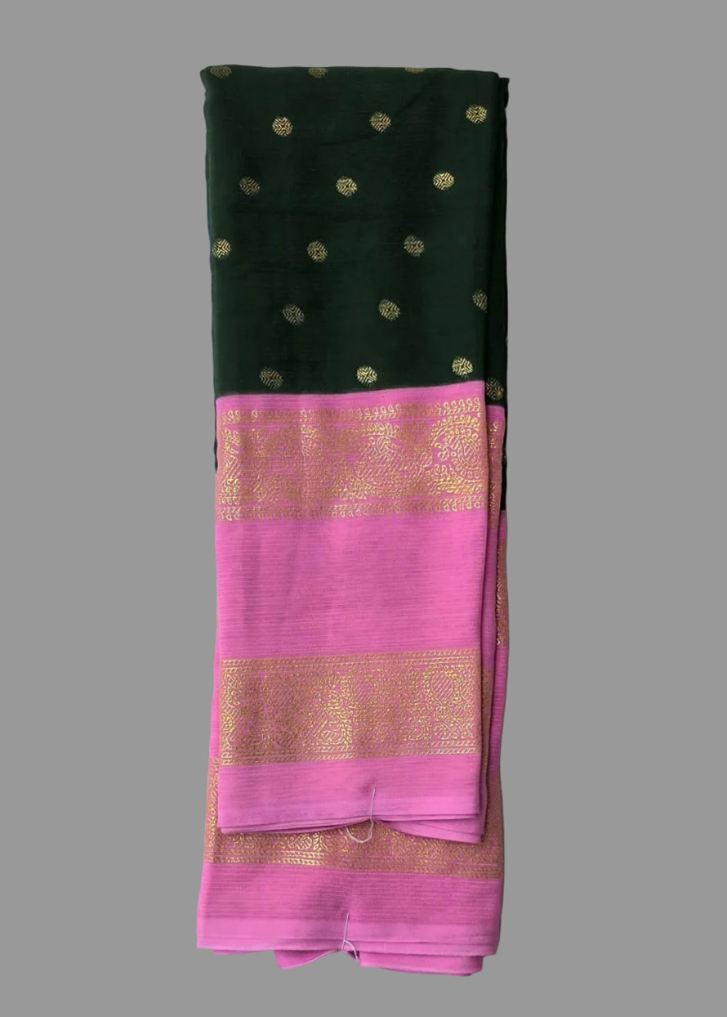 Bottle green colour foil printed saree with pink border with golden buttas