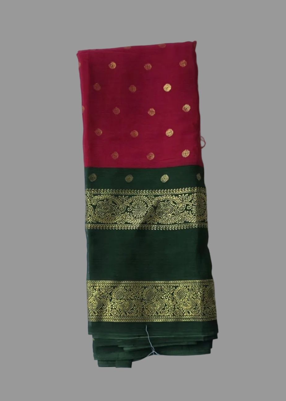 Rani pink colour foil printed saree with dark green border and golden buttas