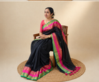Multi colour kanchi border black cotton saree with tussels.