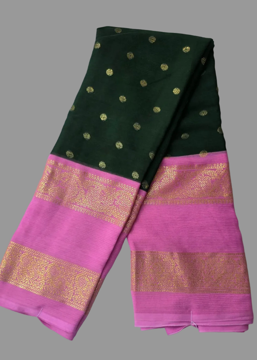 Bottle green colour foil printed saree with pink border with golden buttas