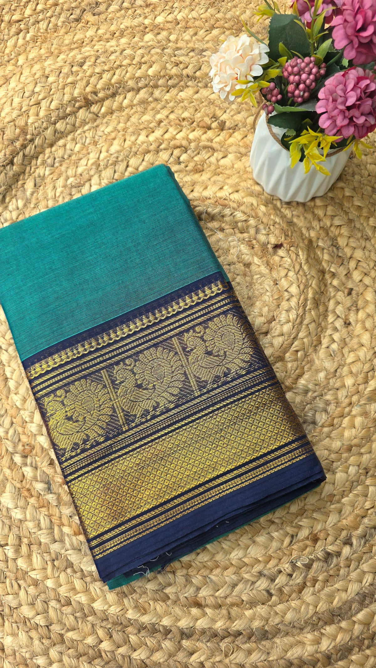 Sea green kanchi cotton saree with navy blue border