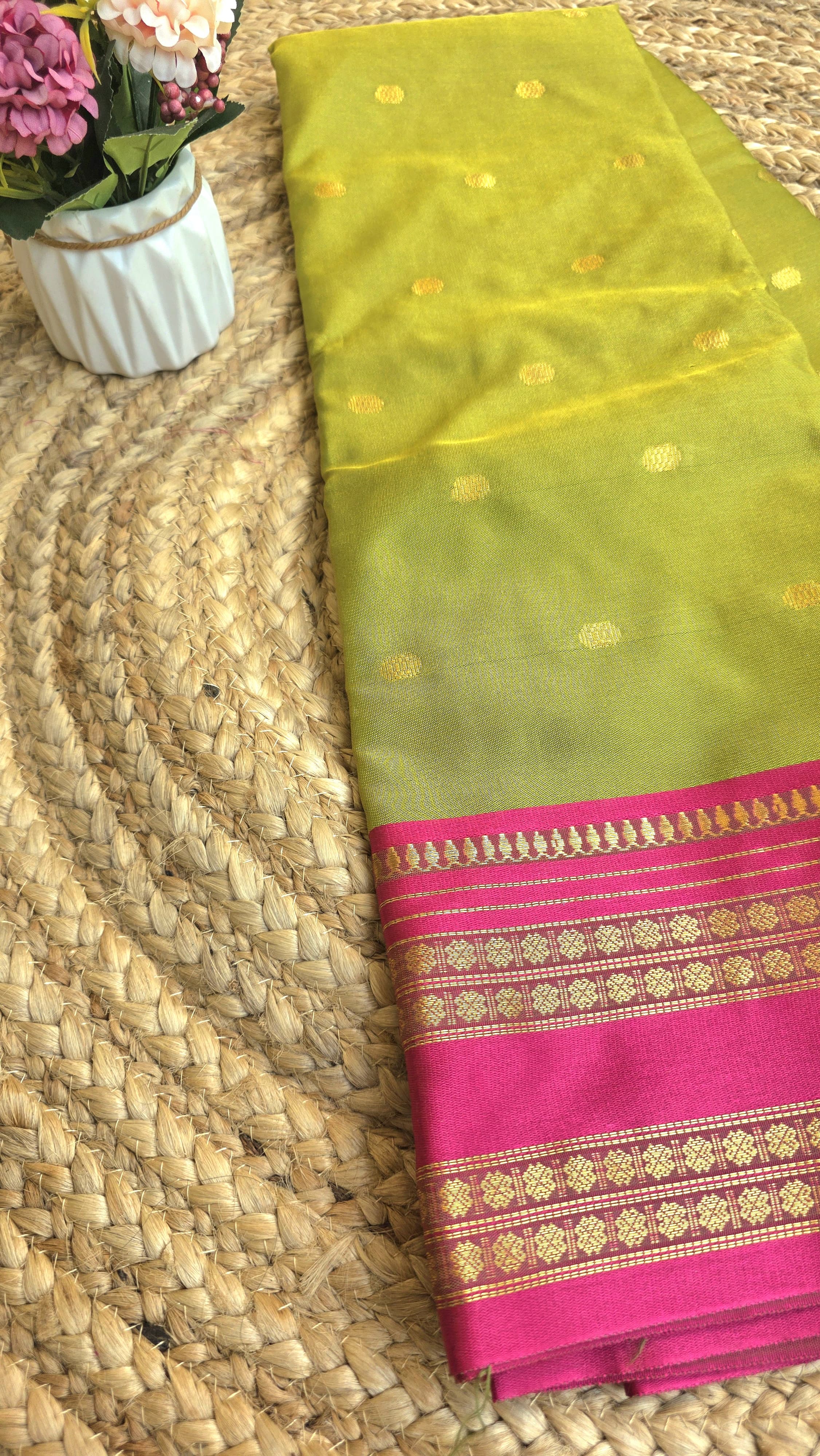 Parrot green colour semi silk saree with rani pink border