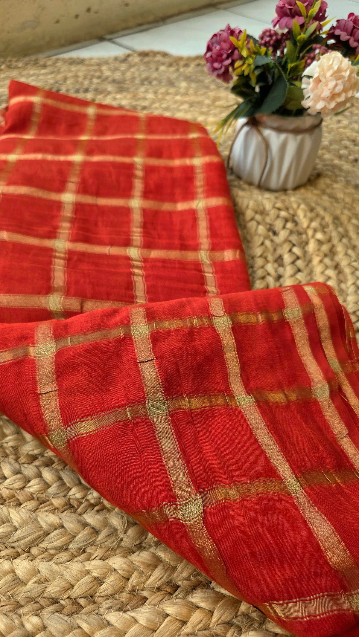 Orange Semi silk saree with golden checks and contrast blouse