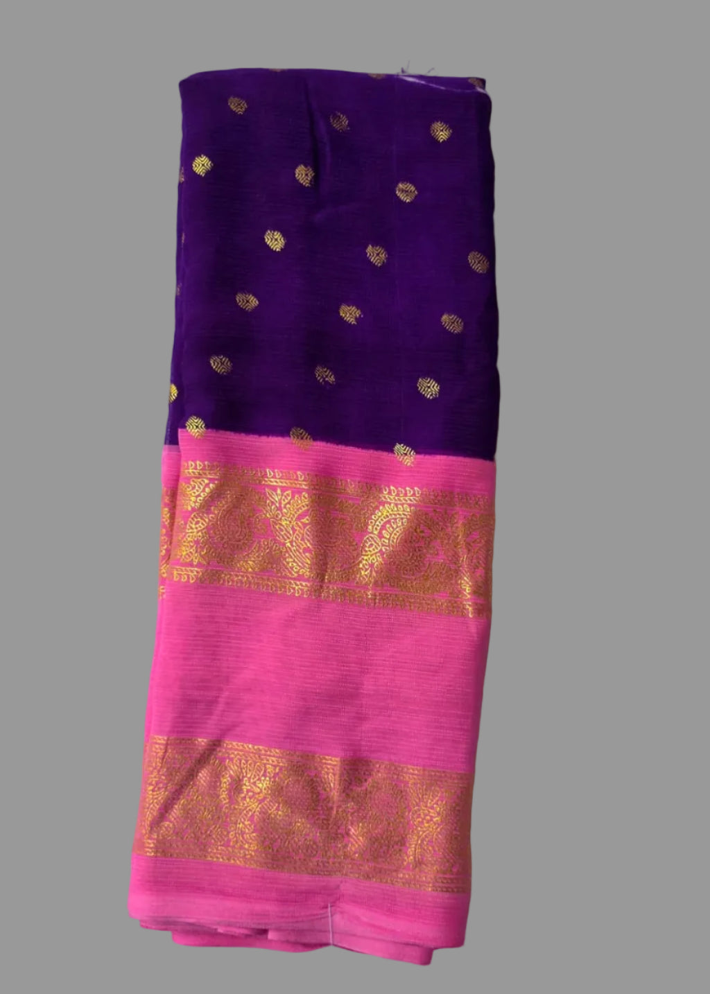Purple colour foil printed saree with pink border and golden buttas.
