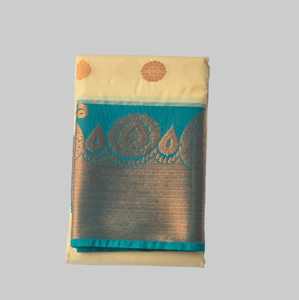 Off white butta kanchipuram semi silk saree with rich ramar green border