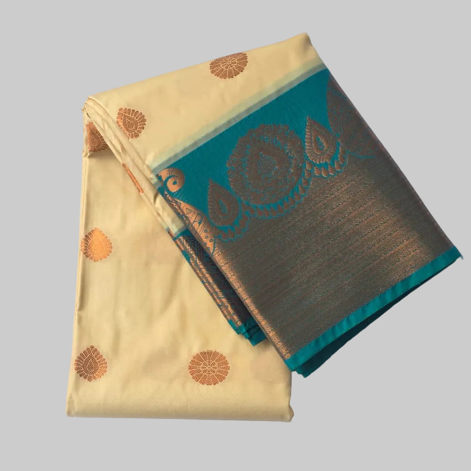 Off white butta kanchipuram semi silk saree with rich ramar green border